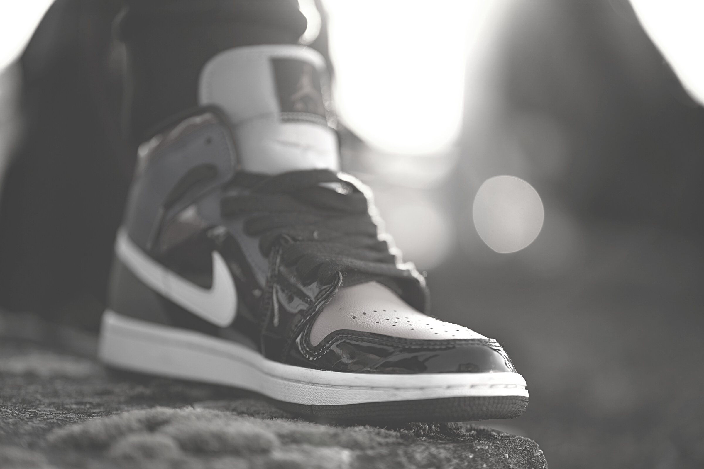 Selective Focus Photo of a Shoe with Black Laces